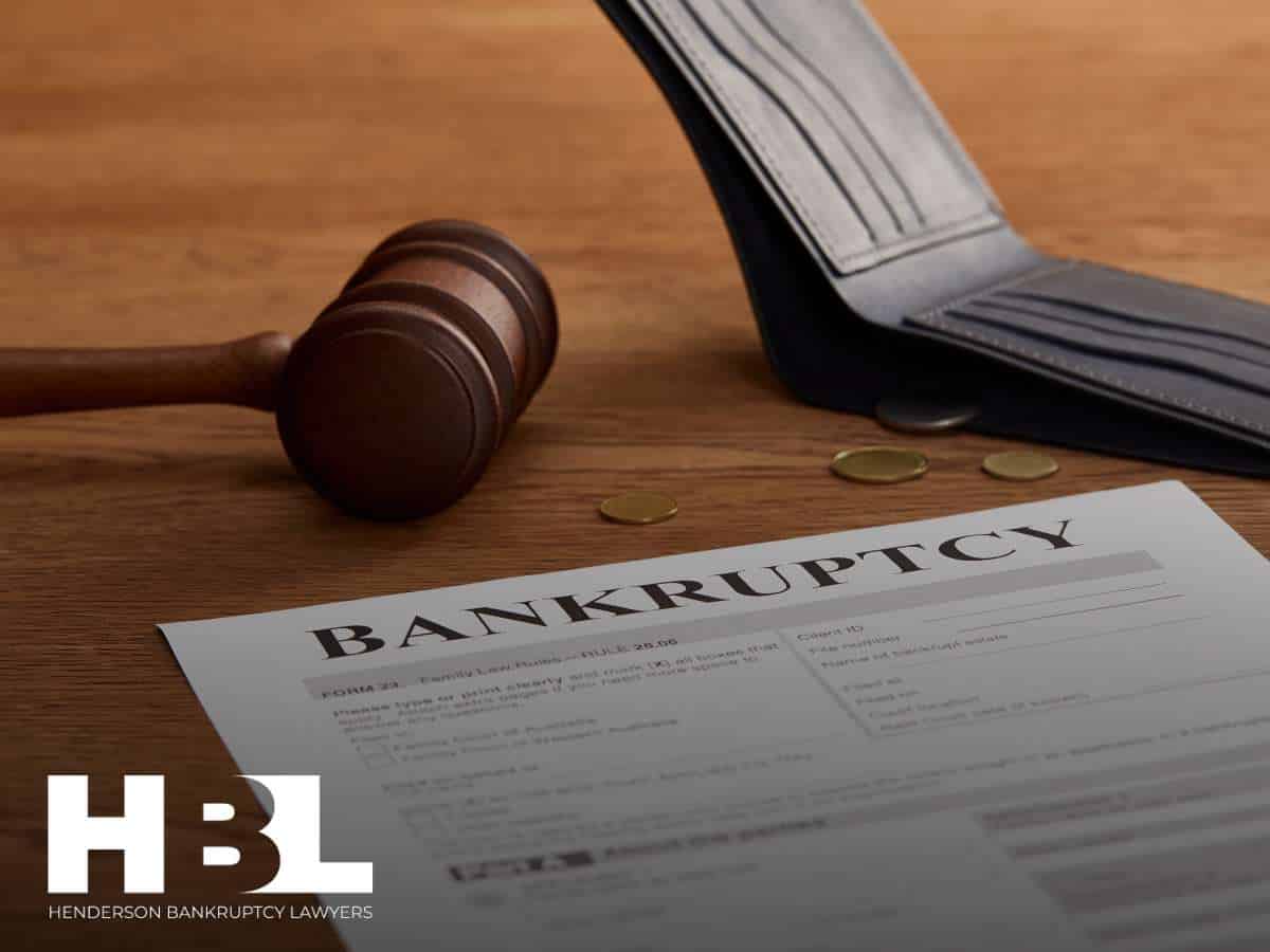 Bankruptcy document and gavel with coins symbolizing Las Vegas entertainment venue filing for bankruptcy