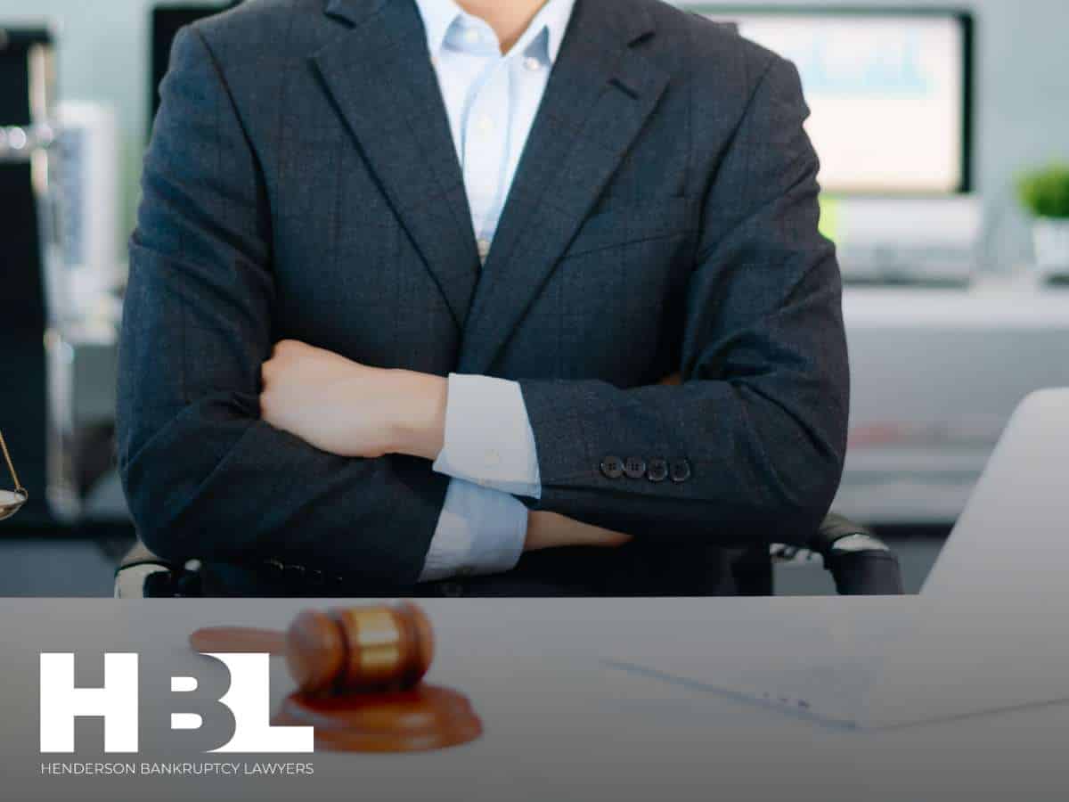 Attorney at a desk, representing clients during bankruptcy proceedings, with emphasis on the 2025 bankruptcy rate.